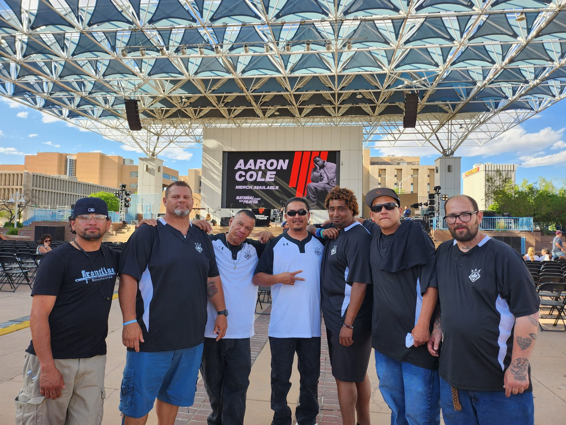Men of Under HIS Construction standing together at a community event